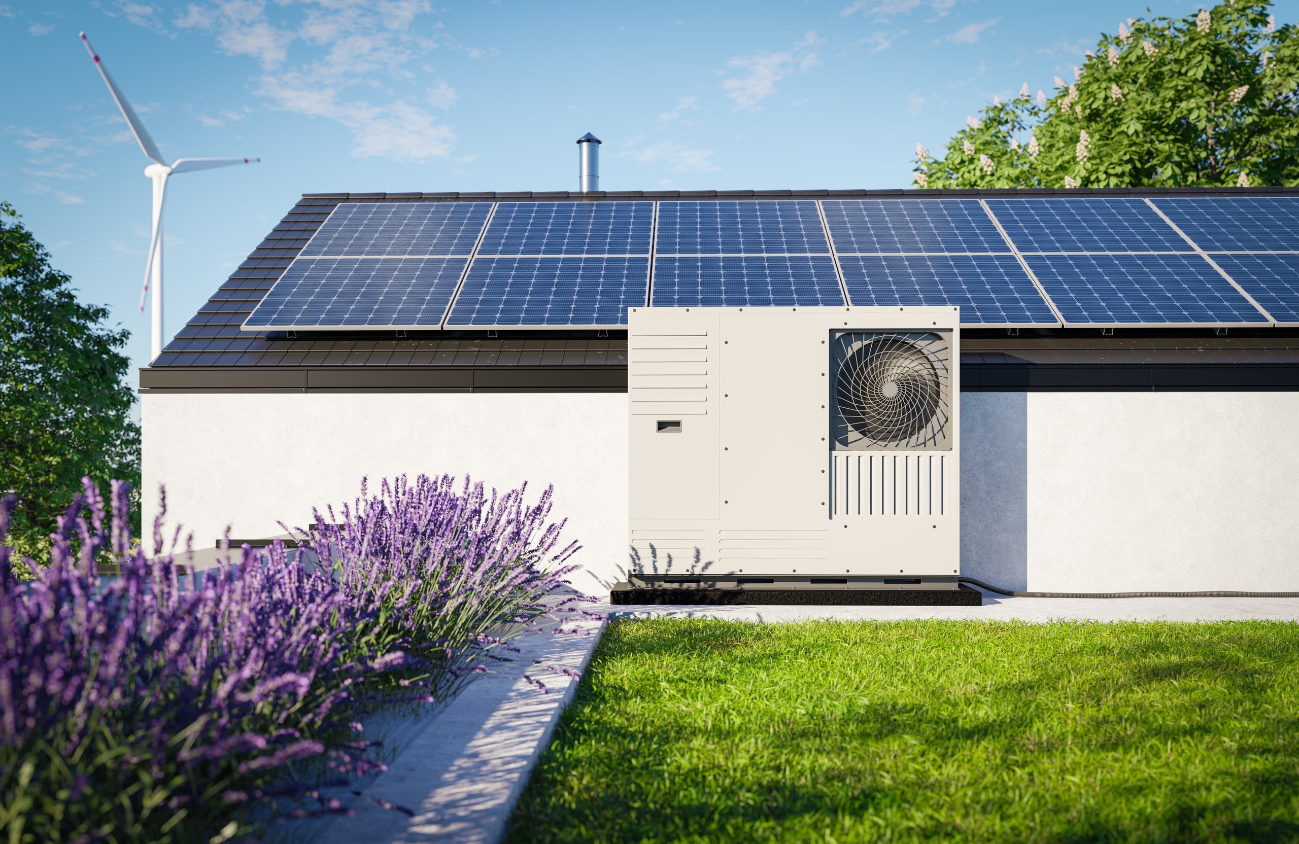 Wärmepumpe vor einem Haus mit Solaranlage